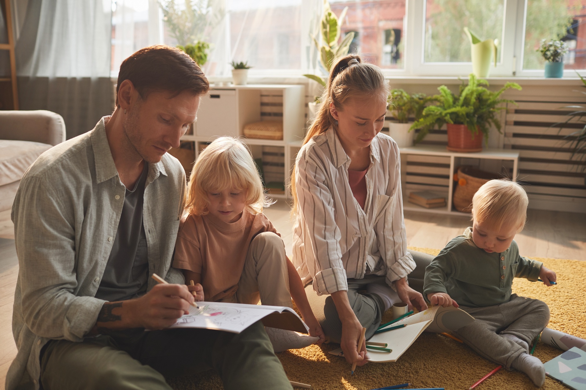 Young family engaging in learning activities from streaming service FamilyCast at home