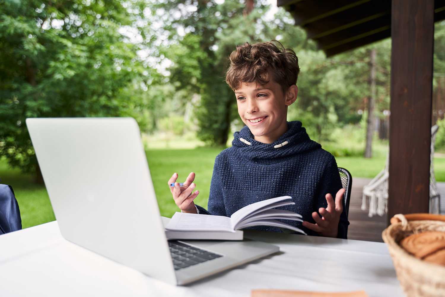 Primary aged Victorian student learning online from back deck at home