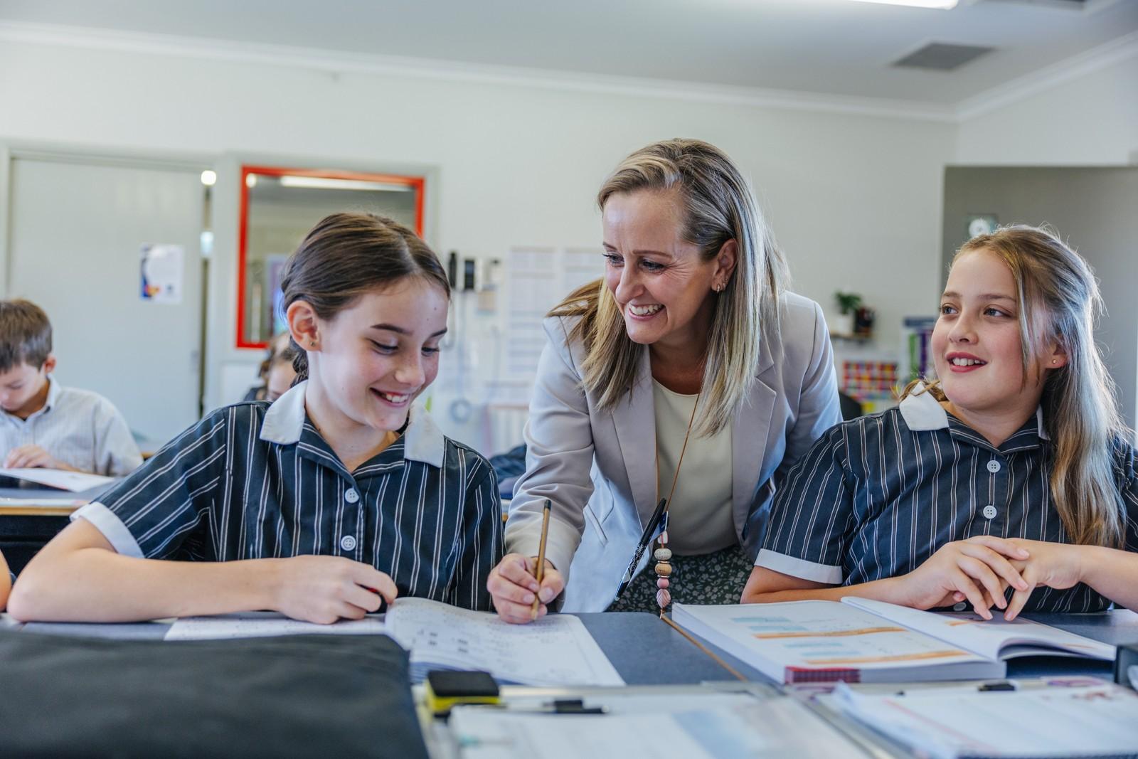 Teacher engaging with students in an ACC Victoria classroom